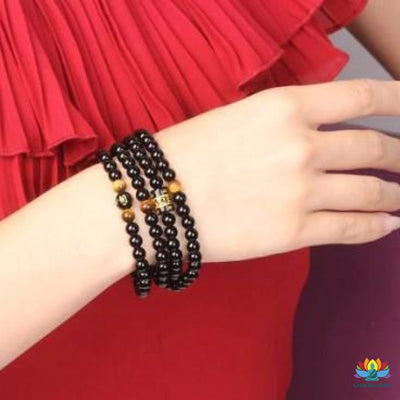 Mâlâ Double protection en Oeil de Tigre & Onyx